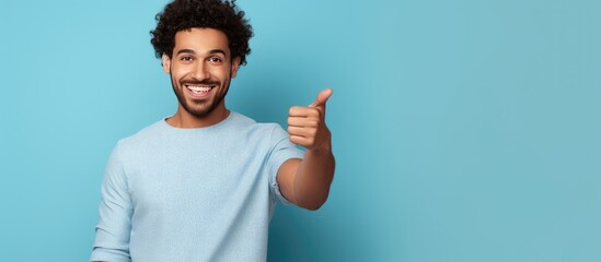 Middle eastern male volunteer posing and smiling at camera advertising volunteering project