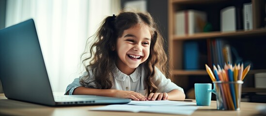 Smiling girl doing online math test at home with help