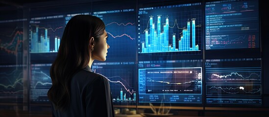 Female analysts reviewing key performance indicators KPIs on a computer monitor