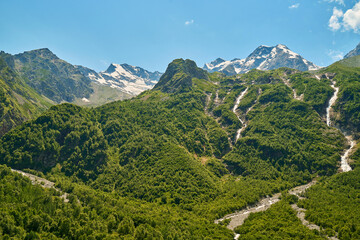 Fototapeta na wymiar panorama of summer mountains with waterfalls