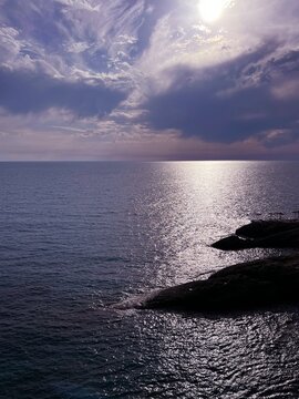 Glittering sea water silver colored water at romantic sunset. 