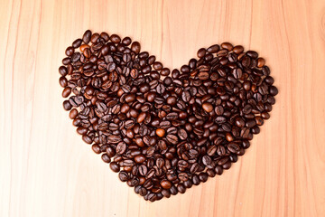 Top view of heart shape from roasted coffee beans