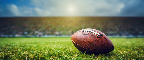 American football ball on a stadium pitch