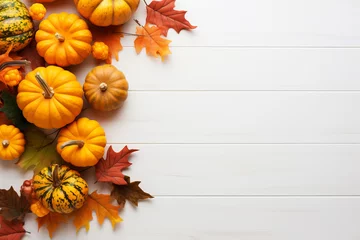 Foto op Plexiglas Festive autumn composition from pumpkins andcolorful leaves on a white wooden background. Thanksgiving day. © colnihko