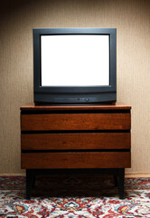 Antique TV with white screen on antique wooden cabinet, vintage design in 80s and 90s style house.