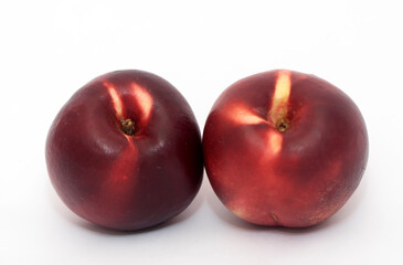 Two red nectarines
