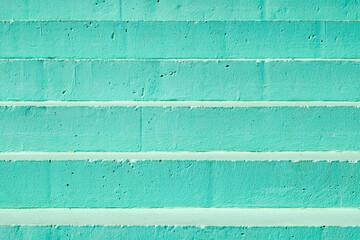 Steps of concrete staircase close-up, painted with green paint