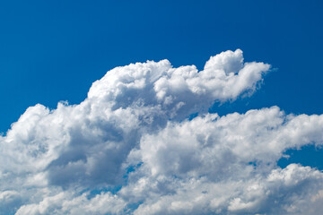 Naklejka na ściany i meble White clouds on blue sky in clear sunny weather