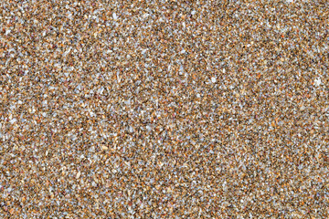 Yellow sand, grains of sand close-up, uniform texture background