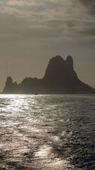 The island of Es Vedra in Ibiza illuminated by a beautiful sunrise
