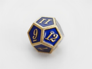 D12 Blue and gold 12 sided dodecahedron dice isolated on white. RPG dice. Dodecahedron DND dice 