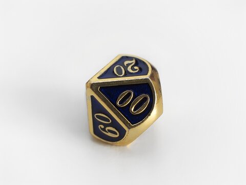 D10 ten sided blue and gold dice. RPG dice. Decahedron DND dice