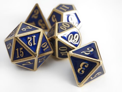 Some RPG DND blue and gold dice isolated on white 