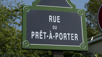 A dummy french street sign of rue du Prêt-à-Porter, prêt à porter street in Paris, France, street with trend names. - obrazy, fototapety, plakaty