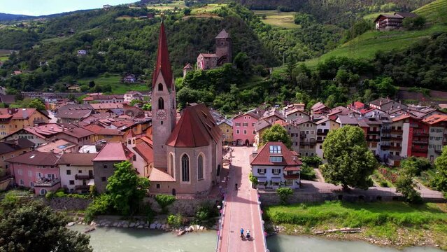 Scenic beautiful places of northern Italy. Charming town Chiusa (Klausen) surrounded by Dolomites mountains. arerial view. Valle Isarco, in Trentino Alto Adige or South Tyrol