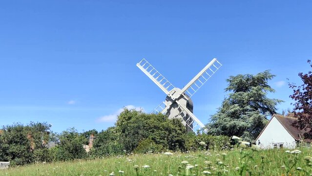 Low angle view of Post Mill, cottage and meadow.

Known as the most photographed village in Essex, Finchingfield is home to one of the county's few remaining windmills and is a charming, picturesque v