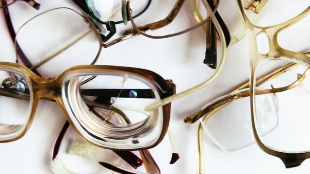 Various old broken glasses for reading