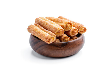 Homemade lemon jam filled sticks in wooden bowl isolated on white