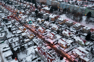 Winter scene from above, snow-covered roofs of houses and streets