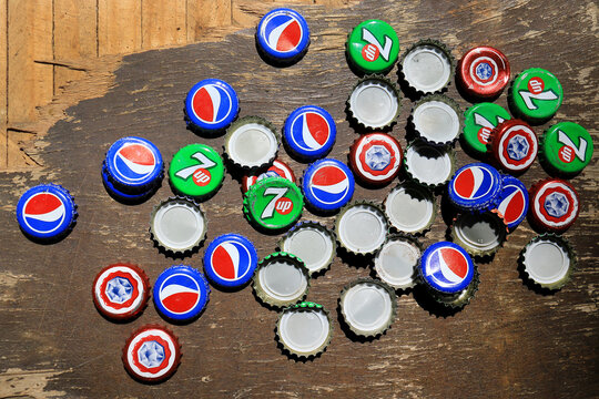 Caps of Pepsi Cola, 7UP, and Almaza Beer Bottles