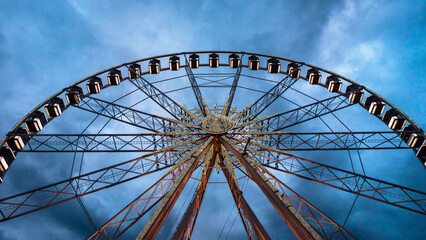 Ferris Wheel of Budapest, Hungary. Cloudy skies and a Ferris wheel. Isolated amusement vehicle.