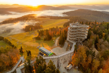 Tree top observation tower in resort town Krynica-Zdroj at sunrise, Poland