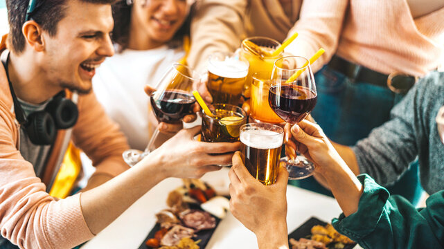 Multiracial Friends Celebrating Party Drinking Cocktails At Bar Restaurant - Young People Having Fun Hanging Out On Weekend Day - Life Style Concept With Guys And Girls Enjoying Time Together