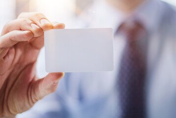 Businessman ,Business Man's hand hold showing business card - close up shot.