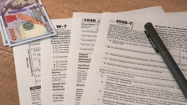 tax forms with pen on a table