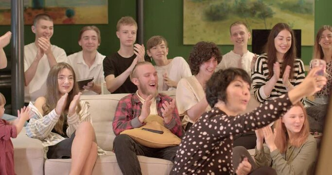 Positive motivation. Greeting closing Clapping is used as a greeting at the beginning lesson or at the end some important part lesson bokeh teacher takes a selfie on phone with group students.