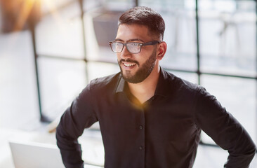 Obraz premium Portrait of smiling young businessman in office