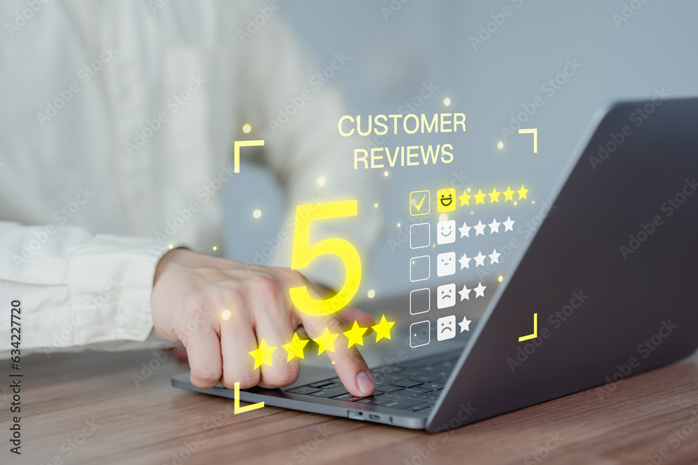 Poster customer hand using a laptop with pop up smiley face and five star icon for assessment feedback revi