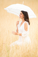 pretty rural woman with umbrella and white dress