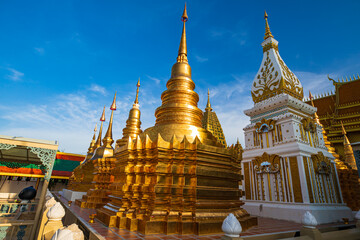 Naklejka premium Pagoda gold and church in wat thai reflect with sun sky in day time in Bangkok Thailand.