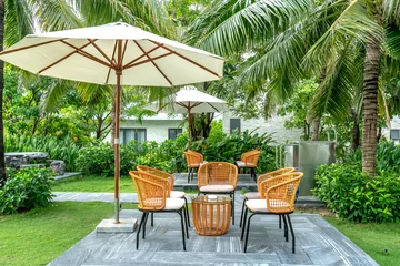 Foto op Plexiglas bamboo and rattan tables and chairs in a quiet and green tropical garden © Quang