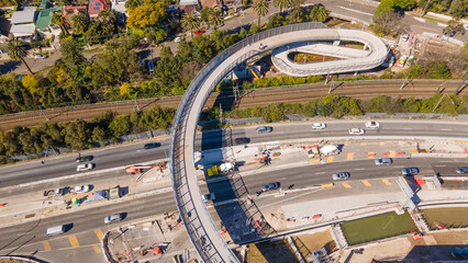 Aerial drone view above the newly constructed walkway overpass bridge at Rozelle Interchange construction works in Sydney NSW in August 2023  