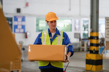 portrait of a smart Caucasian male engineer inspector checking confidence with a background of the warehouse of product stock