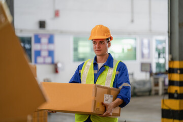 portrait of a smart Caucasian male engineer inspector checking confidence with a background of the warehouse of product stock