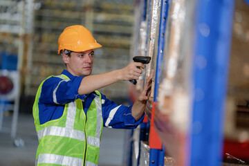 portrait of a smart Caucasian male engineer inspector checking confidence with a background of the warehouse of product stock