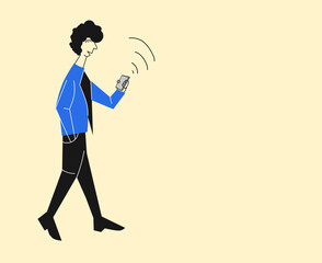 young man walking holding smartphone