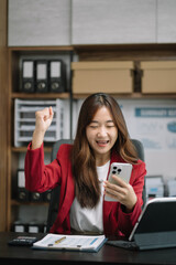 Happy excited smartphone user enjoying, success, achieve, high job result. Euphoric businessman using cellphone, reading text message, feeling joy, making hand winner gesture, laughing