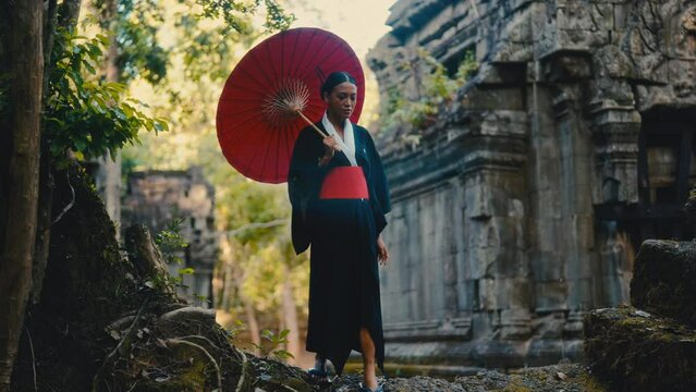 Woman Strolls At Temple In Black Kimono