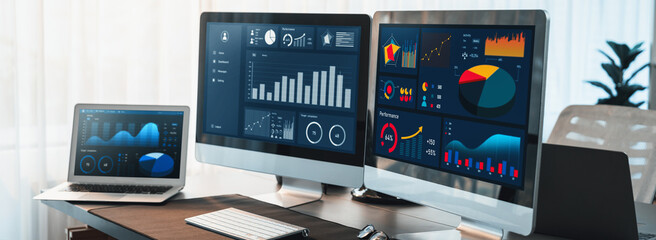 Business intelligence chart and graph display on computer monitor at corporate office. Dark blue interface of dashboard data analysis dashboard. Financial database for business marketing. Trailblazing