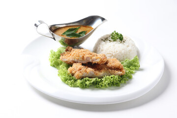 crispy deep fried chicken chop fish cutlet lettuce serve with nonya spicy malay curry leaf sauce and jasmine rice on grey cloth white background design asian chef cuisine halal food menu for cafe