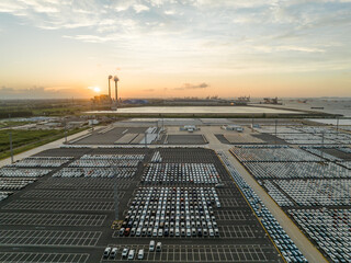Aerial view new car lined up in the port for import and export business logistic to dealership for...