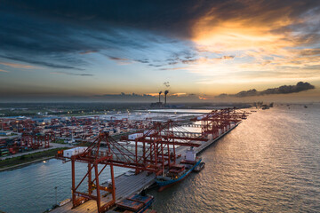 Aerial top view of Container ship loading and unloading, Cargo container in deep seaport for the international order concept.