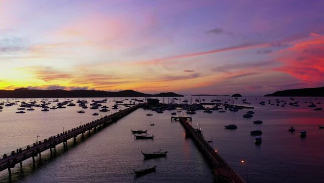.aerial view amazing pink cloud in purple sky in beautiful sunrise above Chalong pier..beautiful sunrise landscape amazing light of nature sky over horizon..colorful sky sunrise background..