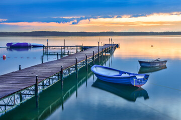 boats on Charzykowskie lake in Poland, beautiful landscape after sunset
