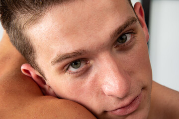 Obraz premium Young attractive gay couple resting on the bed at home.