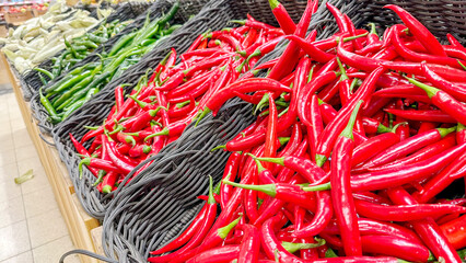 red and green hot pepper on the store counter